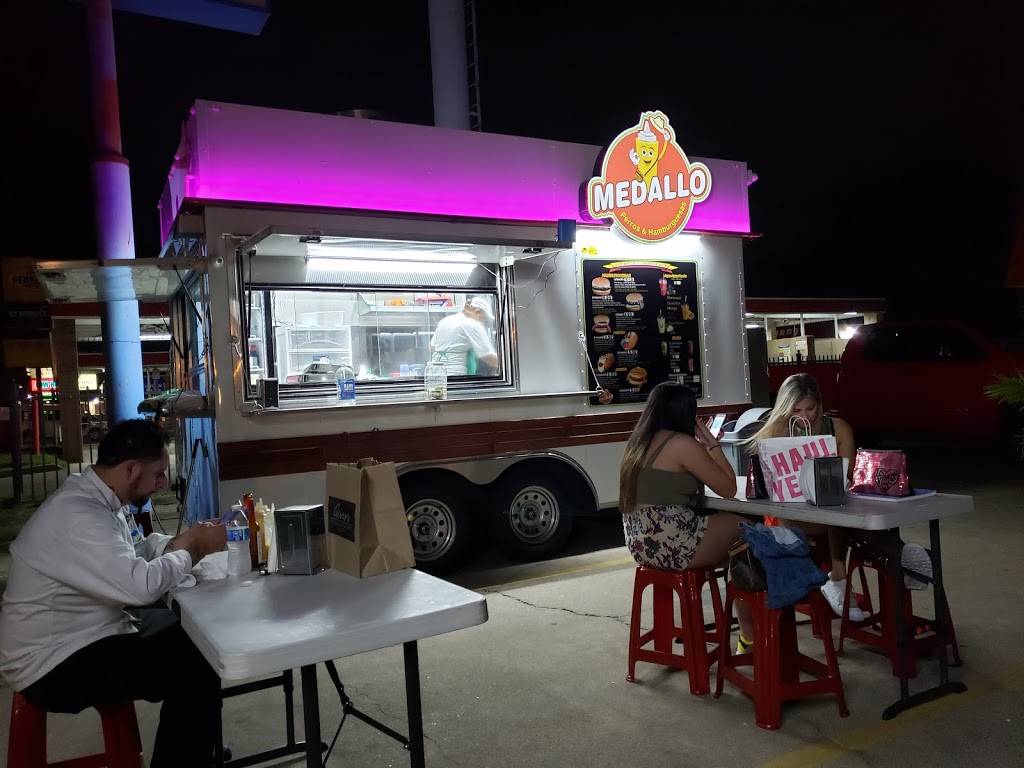 Medallo food truck serving customers at night